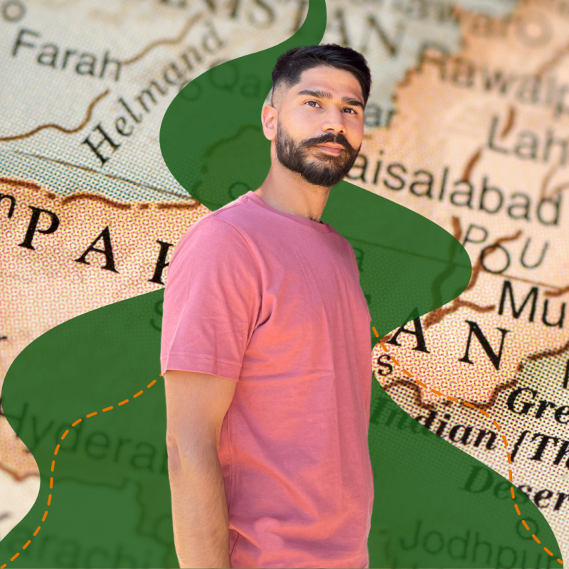 Taimour stands in front of an illustrated green path going across a map of Pakistan