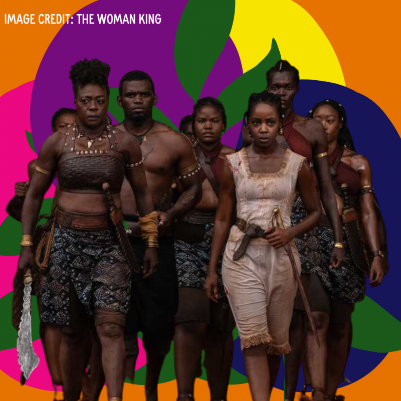 Orange background with circles in coral, dark purple, yellow and dark blue, with a cut out image of The Woman King warriors in front. They are Black women, with natural hairstyles carrying spears and knifes